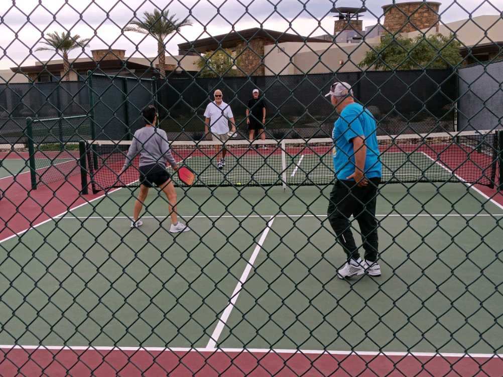 Pickle ball game being played.